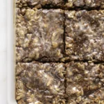 Glazed cinnamon-swirled baked oatmeal in a rectangular baking dish