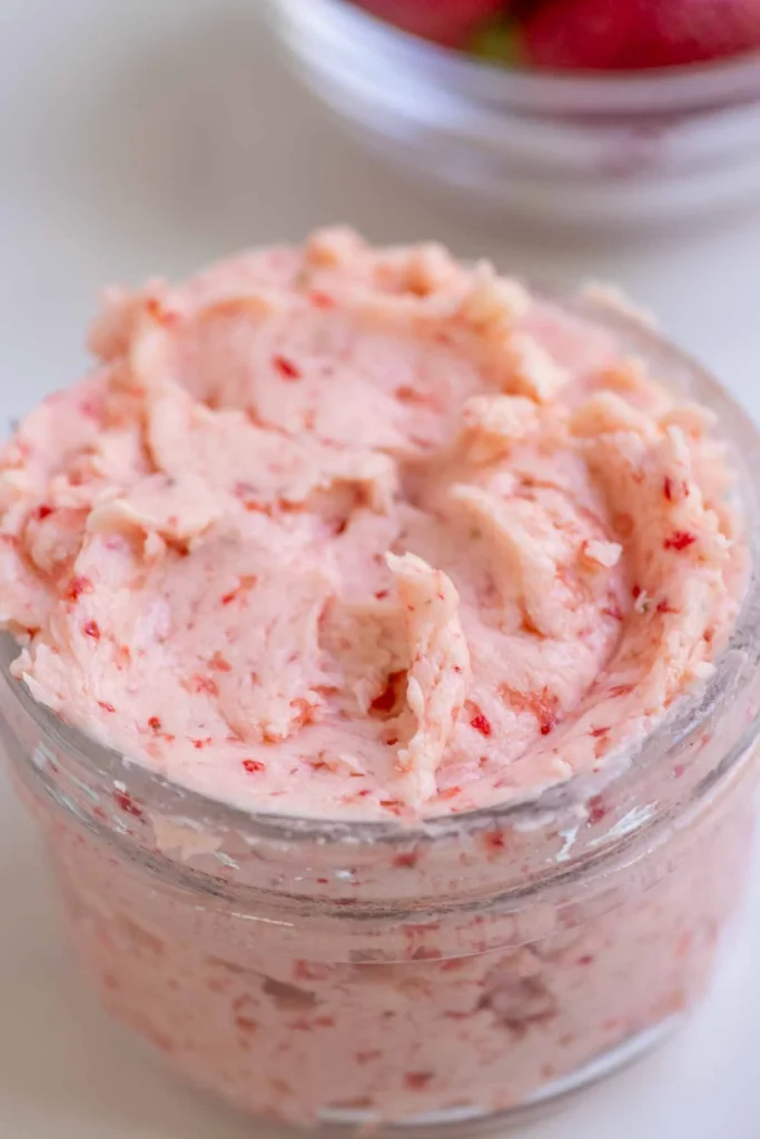 Pink whipped strawberry butter in a ceramic bowl