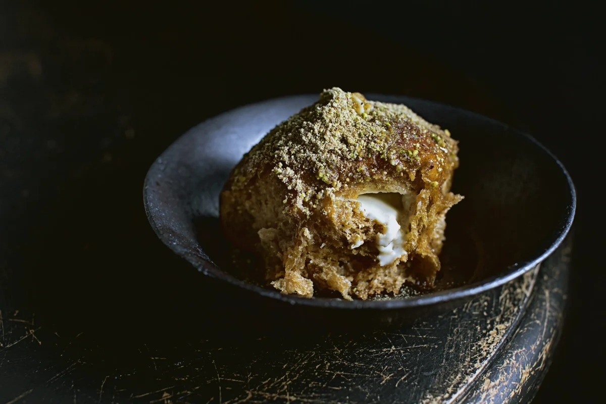 Golden Kahlua bun broken open revealing mascarpone cream filling