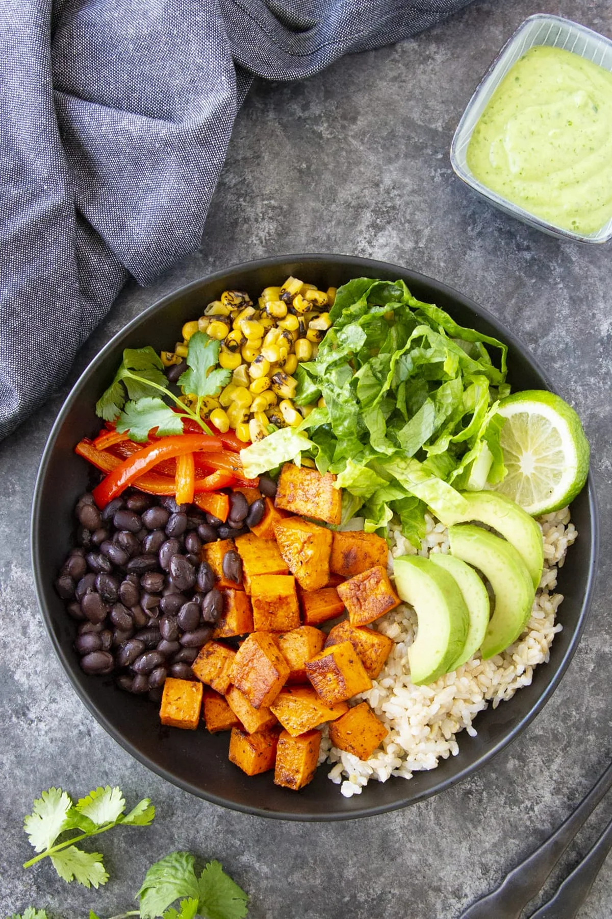 Sweet potato burrito bowls with avocado and cilantro dressing