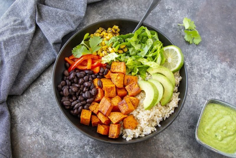 Finished sweet potato burrito bowl with avocado and cilantro