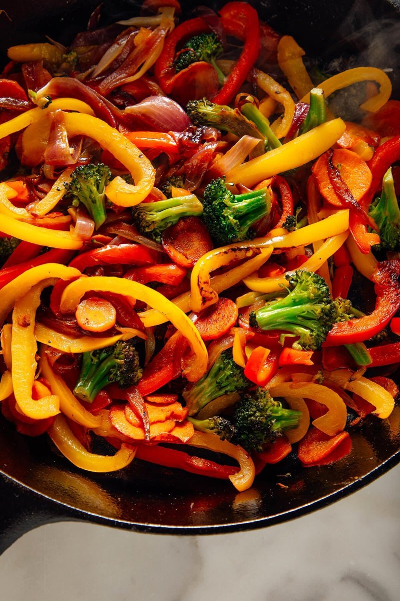 Colorful seared vegetable stir fry in a skillet