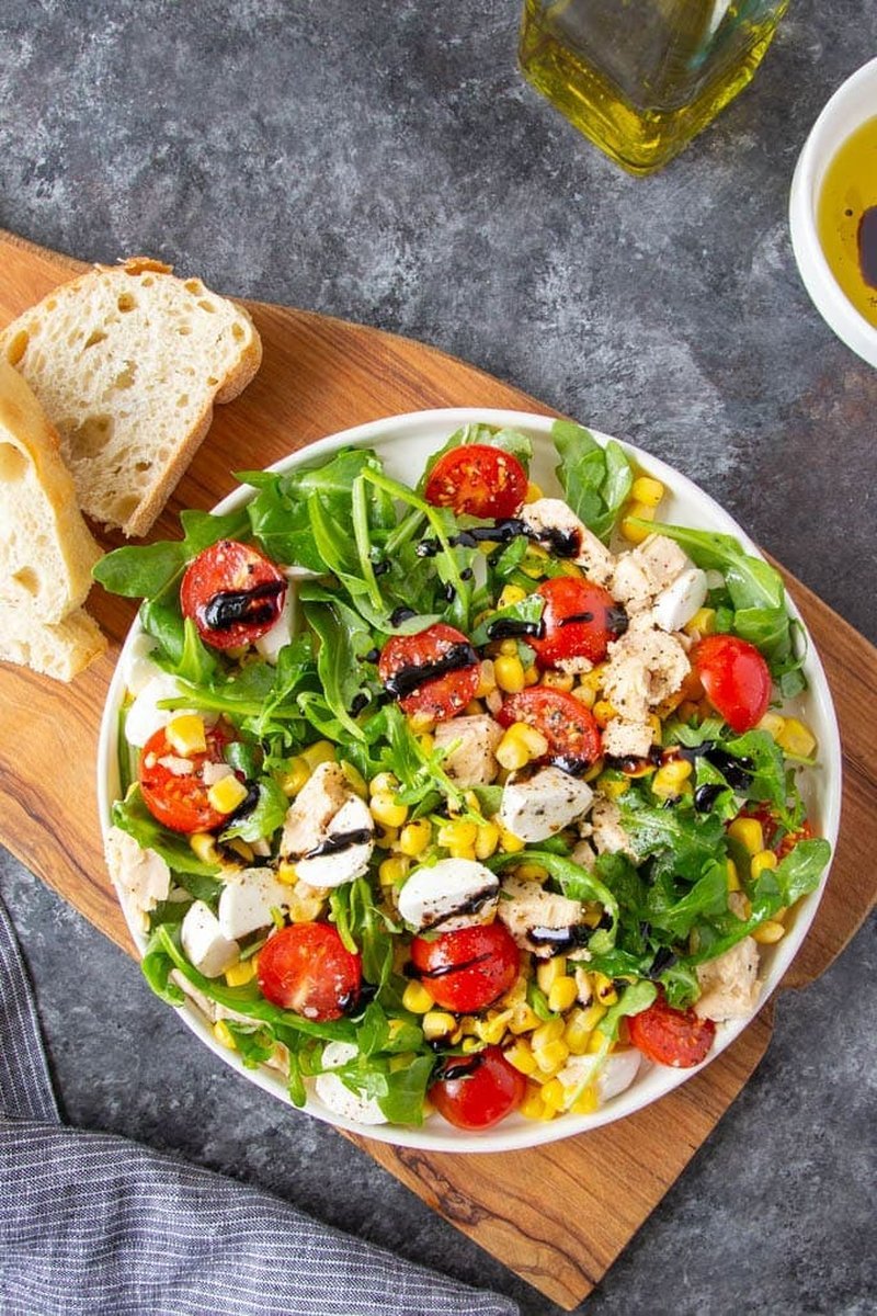 Finished Italian tuna salad topped with corn and mozzarella