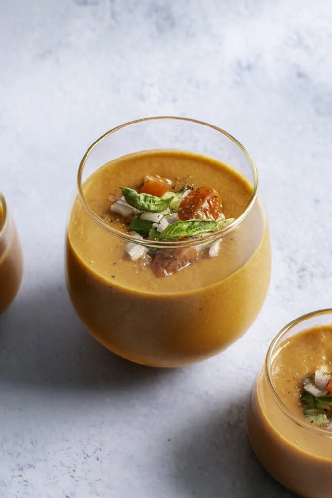 Cherry tomato gazpacho chilled soup in a glass bowl