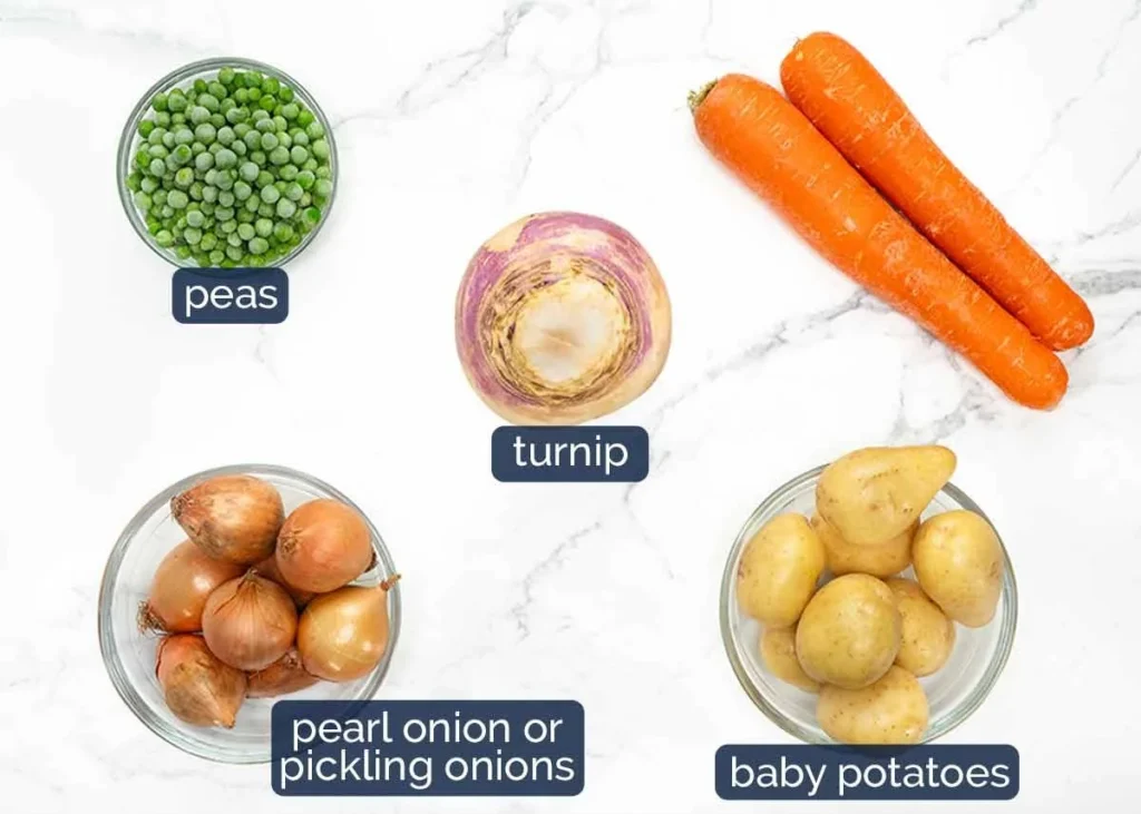 Vegetables for lamb navarin arranged on marble