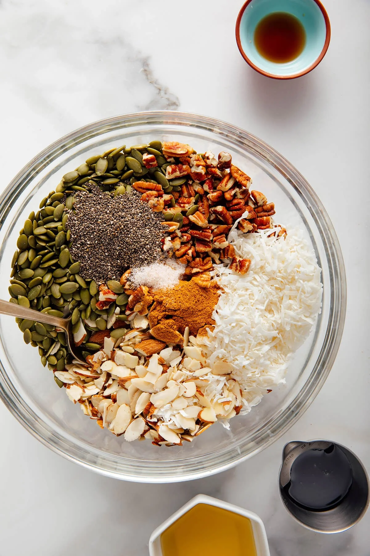 Dry granola ingredients mixed together in a bowl