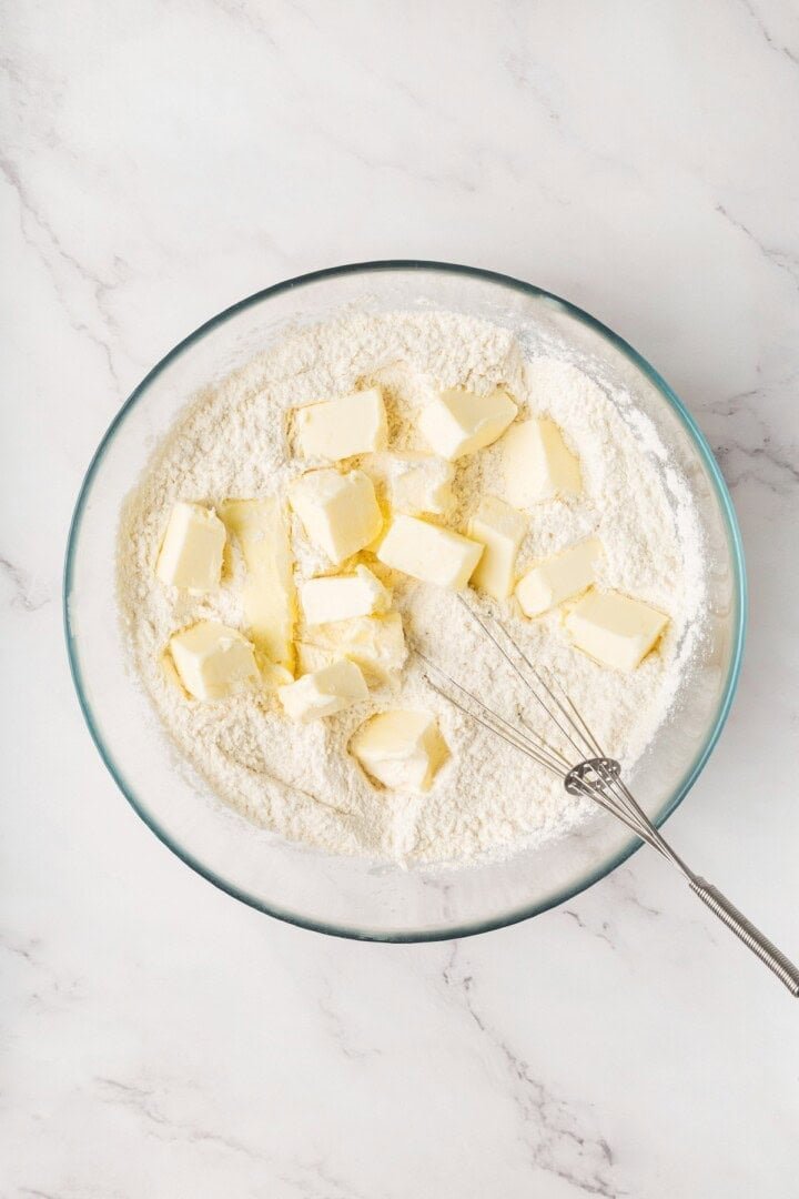 Cubed vegan butter added to flour mixture