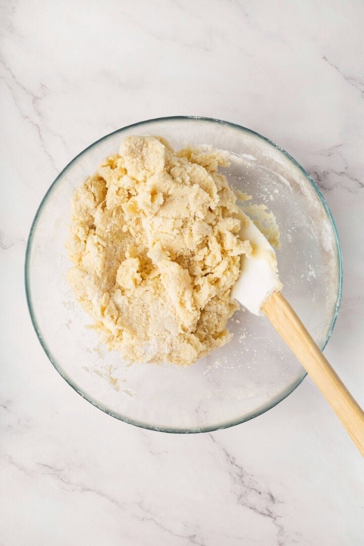 Biscuit dough being folded with a spatula